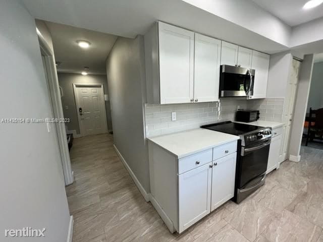 Building Photo - 3 br, 2 bath House - 1410 NE 56th Ct # 1412
