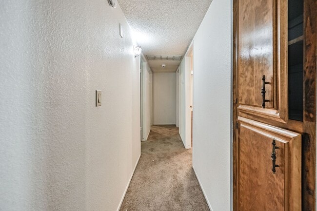 Building Photo - 3 bedroom, 2 bath with large living room and brick fireplace.  Good size kitchen with tons of cab...