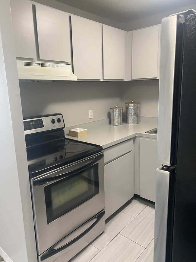 Kitchen features Stainless Steel Appliances - Vida Apartments