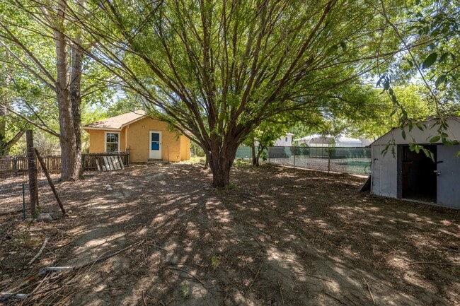 Building Photo - 2-Bedroom Home with Fenced Yard & In-Unit Laundry