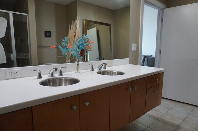 Bathroom also received custom cabinets, countertops, sinks, and faucets. This is a before photo. - 1208 E Kennedy Blvd