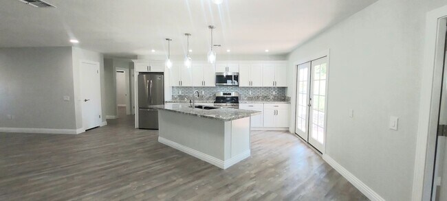 Building Photo - * UTILITIES INCLUDED * TOTALLY REMODELED 2X2