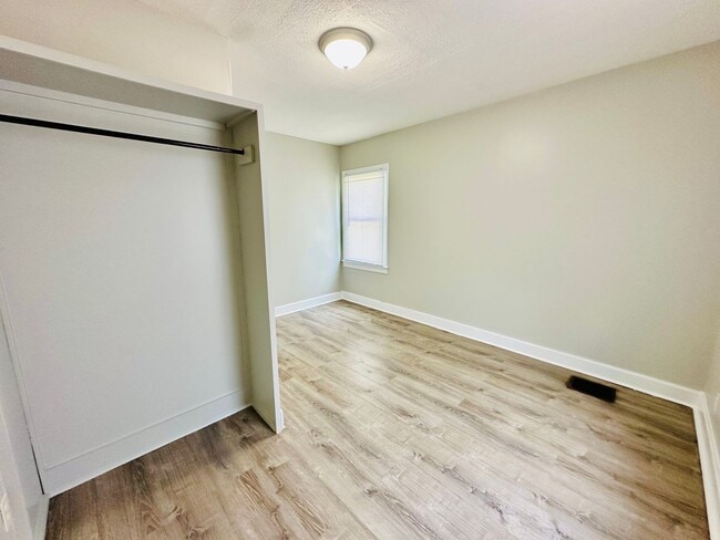 Building Photo - Updated two story home with unfinished bas...