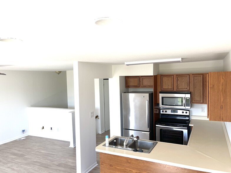 View of kitchen from dining nook looking into upstairs living room - 1921 Acorn Road