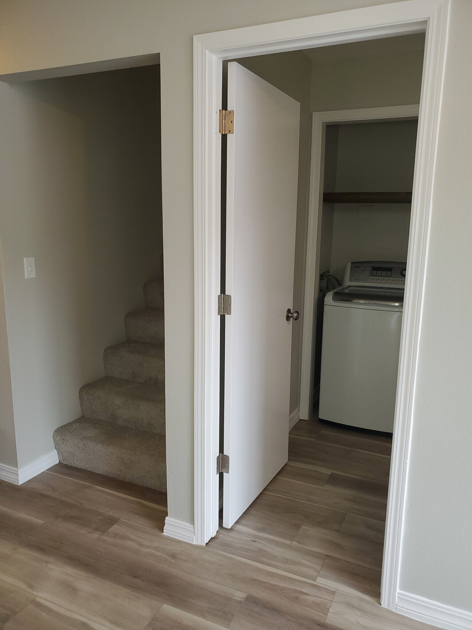Entrance to downstairs half bath and stairway - 625 E 22nd Ave