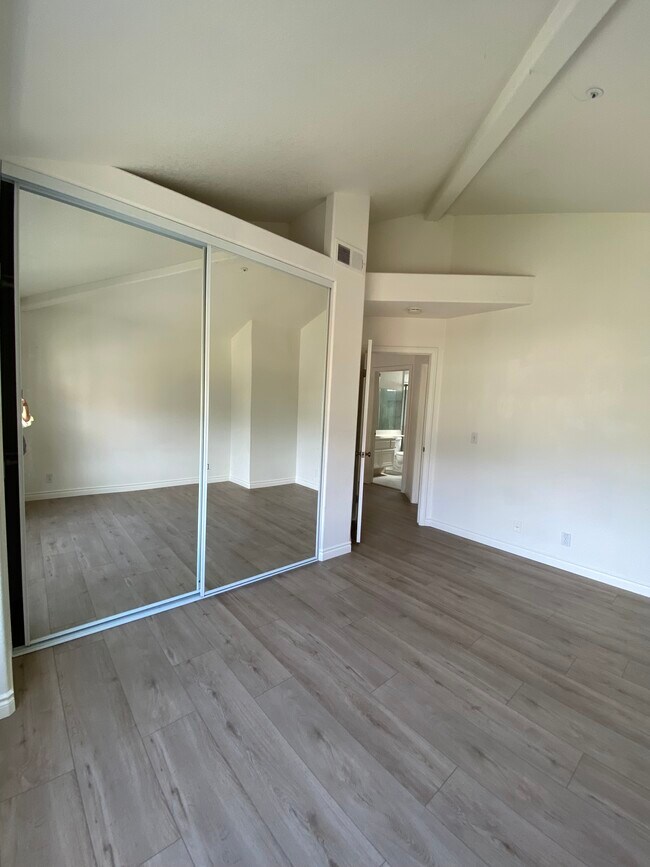 Bedroom 2 with brand new flooring and paint - 915 W Arrow Hwy