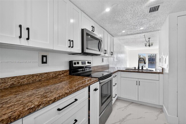 Building Photo - 9915 W Okeechobee Rd