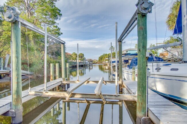 Building Photo - Live the Gulf Breeze Waterfront Life – Dock, Canal Access & Boat Lift!
