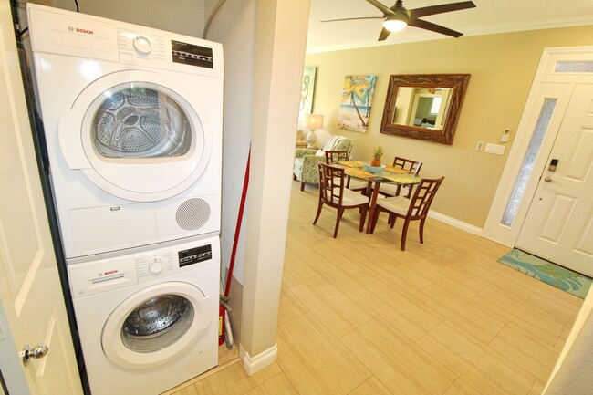 Building Photo - Beach Style 2 bed/2bath Luxury Condo - Finely Furnished - Steps from the Beach - Resort Amenities -