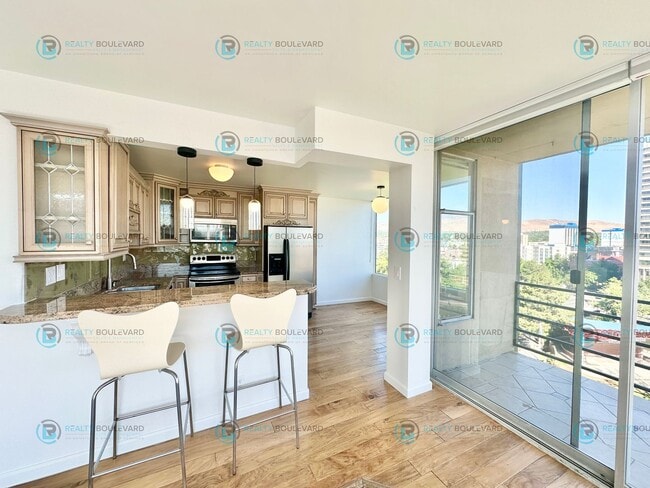 Building Photo - Exquisite 1-bedroom, 2-bathroom condo Overlooking the beautiful Truckee River with covered parking!