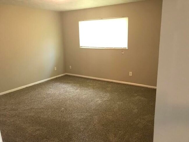 Building Photo - Spacious 4 Bedroom Home With Garage And Modern Updates