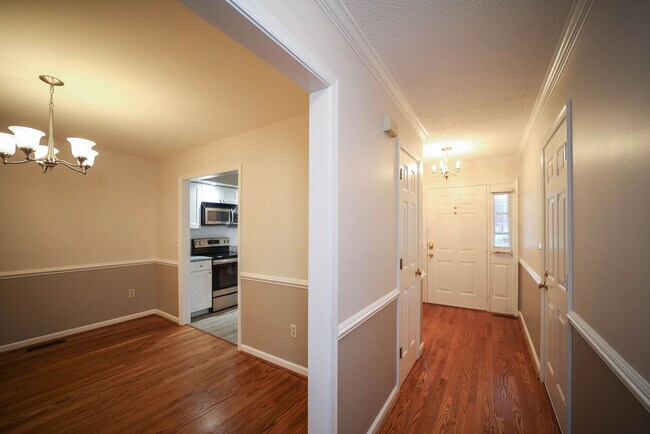 Hallway looking at entryway, dining room, kitchen - 109 Pelham Dr