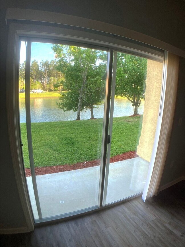 Building Photo - Spacious 3-Bedroom Condo with Pond Views &...