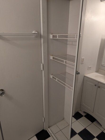 Bathroom storage - 1524 Pensacola St