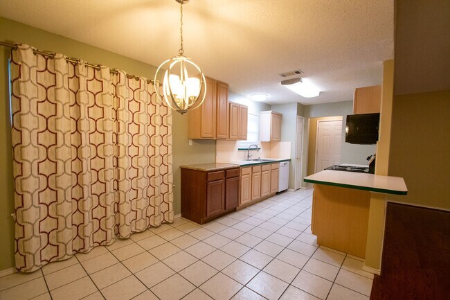 Building Photo - Cozy Fireplace, Bright Kitchen, and a Backyard Built for Gatherings