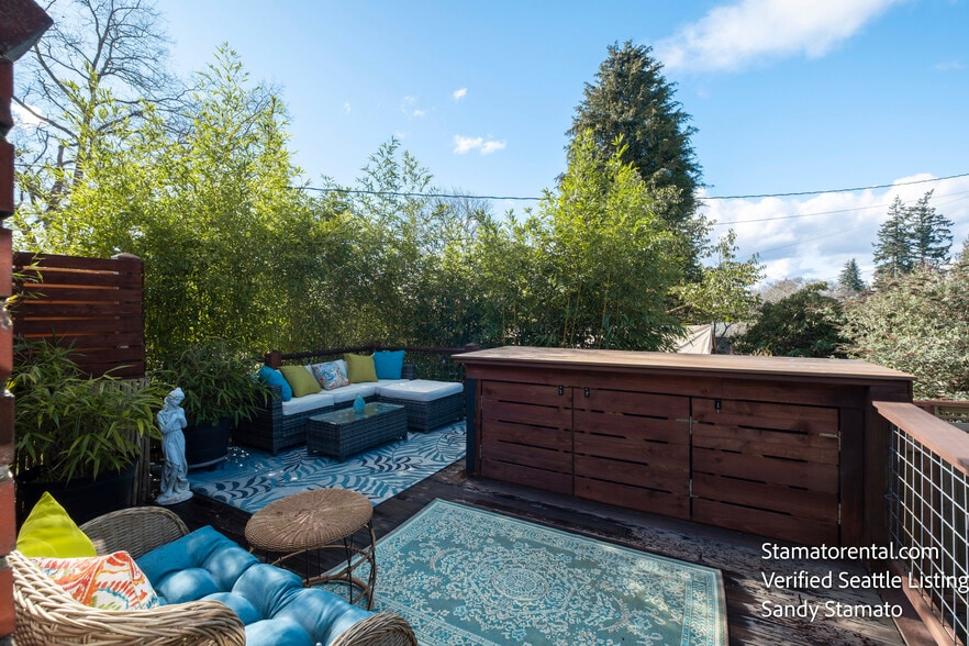 Private deck surrounded by bamboo and mature gardens. - 11639 1st Ave NW