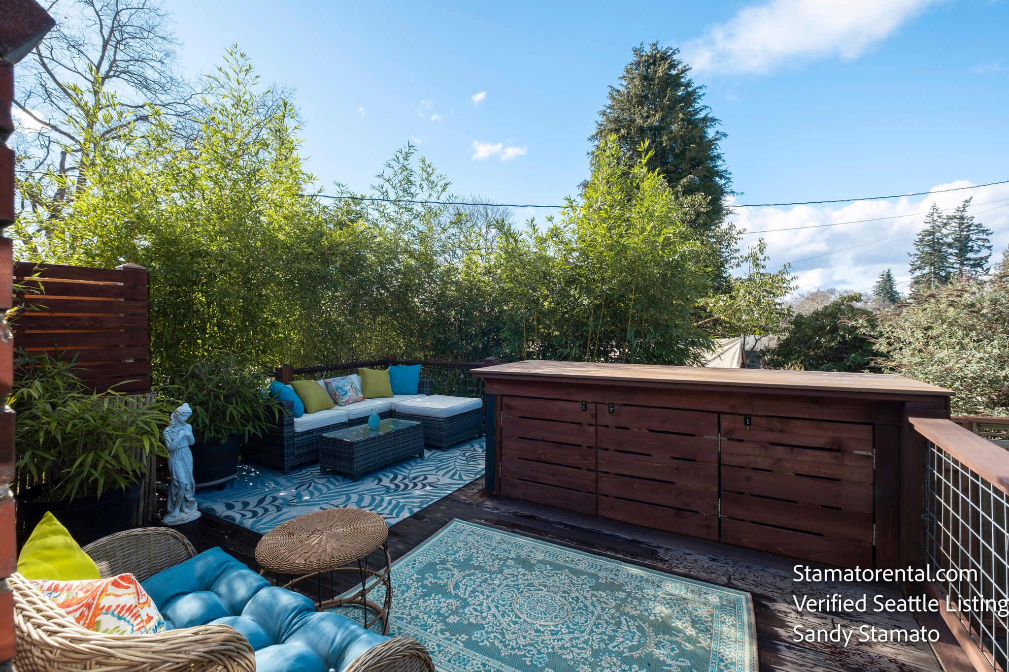 Private deck surrounded by bamboo and mature gardens. - 11639 1st Ave NW