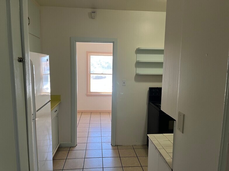 Kitchen from hall looking into Dining Room - 902 E Amelia Ave