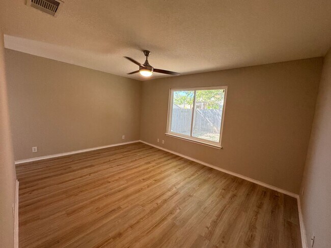 Building Photo - NEW PAINT, FLOORING, APPLIANCES & ROOF  | ...