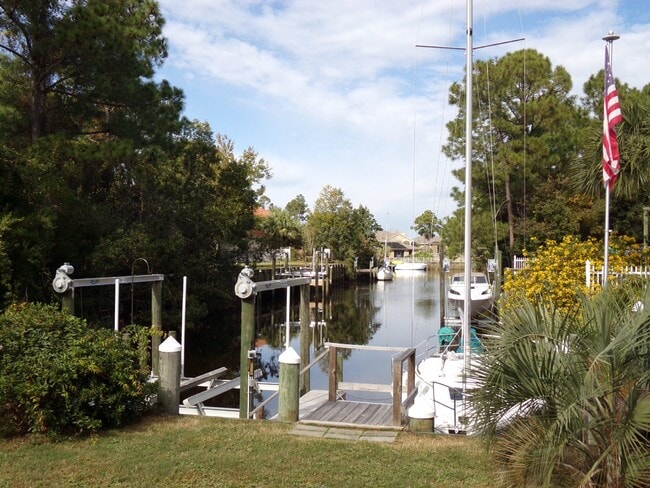 Building Photo - Live the Gulf Breeze Waterfront Life – Dock, Canal Access & Boat Lift!