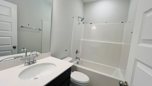 Building Photo - BRAND NEW & Beautiful Townhome with 2 car ...