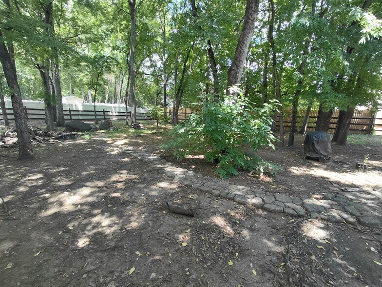 Fenced shaded backyard. - 5043 Wheat Dr SW