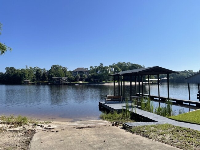 Building Photo - Riverfront Living with Private Boat Launch