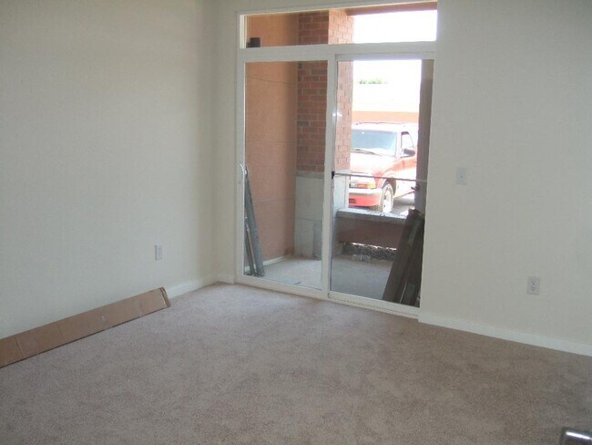 Building Photo - "Spacious 3-Bedroom Denver Condo with Cozy Fireplace & Modern Comforts!"
