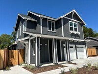 Building Photo - Coming soon! Lower unit  2 bed 1 bath townhome with attached garage