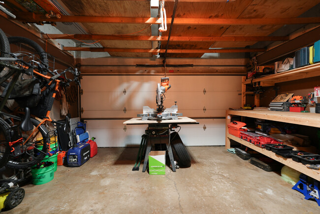 Garage. Perfect space for fabrication shop, storage, or to park your car. Has woodstove - 2507 3rd St NE