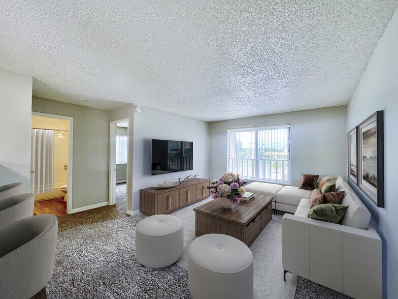 AP 2 BR, 1 BA - Living Room - The Stapleton Apartments