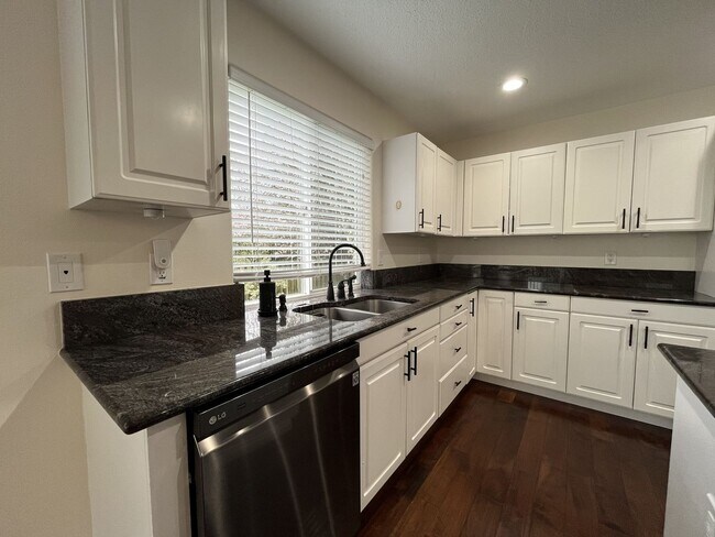 Building Photo - Grand 5 Bedroom Home Featuring 19ft Ceilings, Family Room & Main-Level Suite