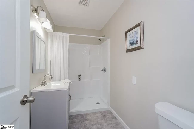 Master bathroom with new vanity, sink, toilet, and large walk-in shower. - 1 Bent Twig Dr