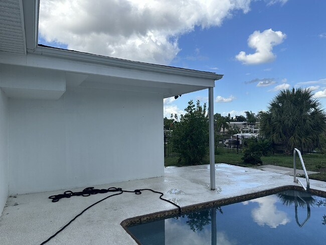 Building Photo - "Elegant 3-Bed Waterfront pool Home"