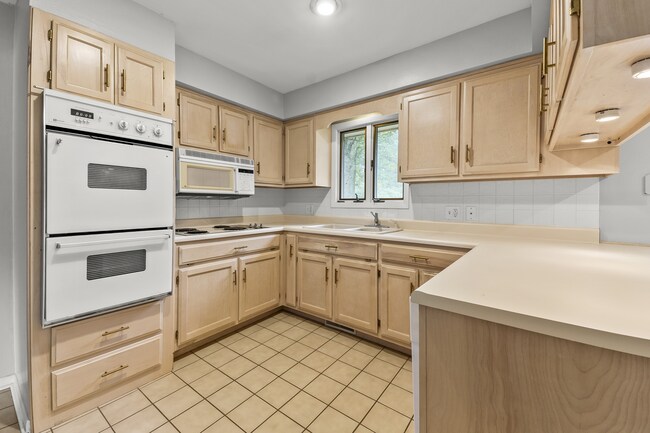 Tons of cabinet space in kitchen. - 1618 Oak Hills St