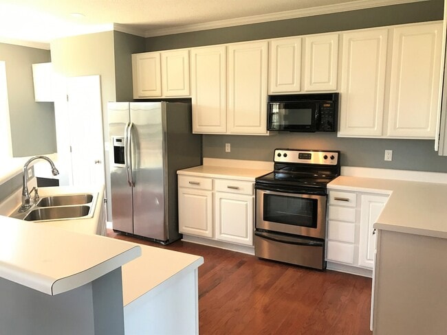 Building Photo - Great Family Home -  Fenced Backyard - Garage!