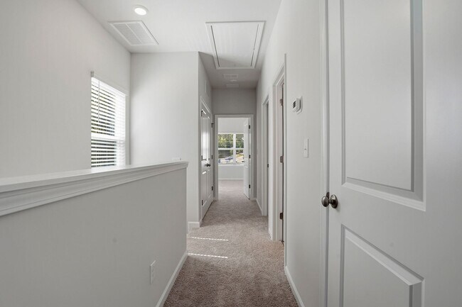 Building Photo - BRAND NEW TOWNHOME-9 FOOT CEILINGS-TWO CAR GARAGE-POOL COMMUNITY