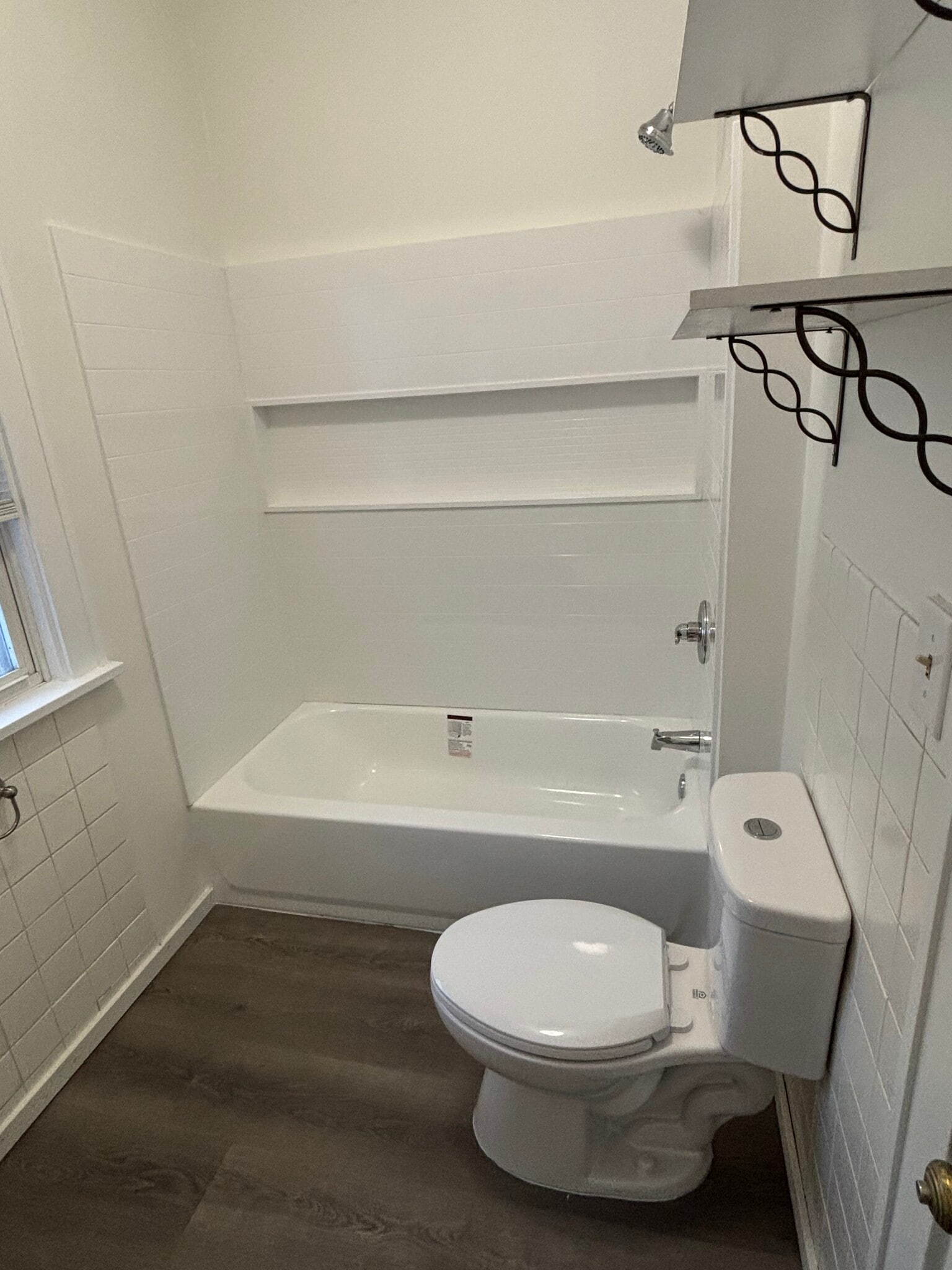 Updated Main floor bathroom - new shower, tub, toilet and vanity - 1003 S Elm Ave