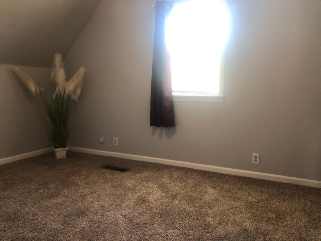 Third bedroom with new ceiling fan - 210 Golden Pond Ave