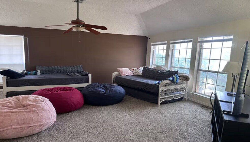 Step into the second-floor game and movie room - 10913 Alexandria Dr