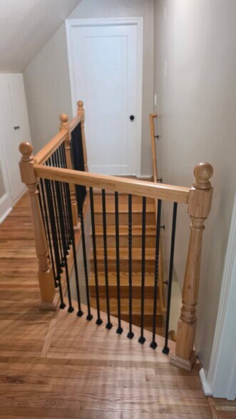 Bright upstairs landing with updated railings and bedroom access. - 1901 -2301 Fillmore Street NE Minneapolis, MN 55418