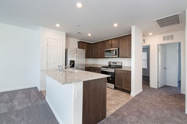 Building Photo - Newer Townhome - 3 Bedrooms + 2 Car Garage - E Craig & Nellis