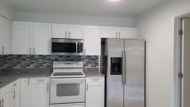 Building Photo - POS Holdings LLC-718-720