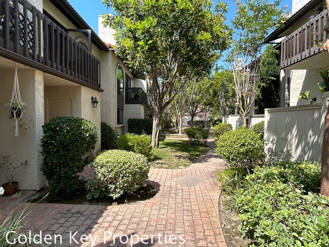 Building Photo - Welcome to this stunning ***unfurnished*** tri-level condo in the desirable Casitas de la Costa c...