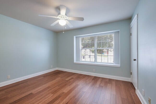 Building Photo - Modern Elegance: 3-Bedroom Townhome with Wood Flooring, Shaded Deck, and Inclusive Amenities