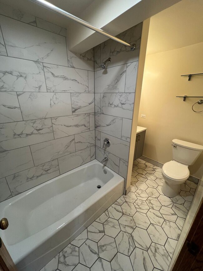 Building Photo - Stunning updated Wrigleyville 4-bed, 3-bath duplex featuring a modern kitchen, renovated baths & ...