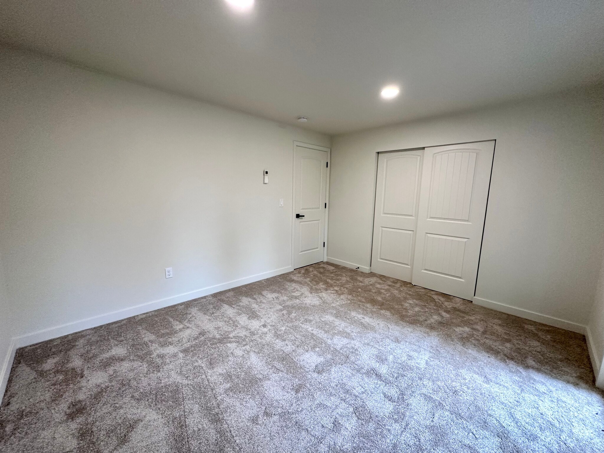 Bedroom 1 with a balcony, new carpet, paint, split - 1014 W 23rd St