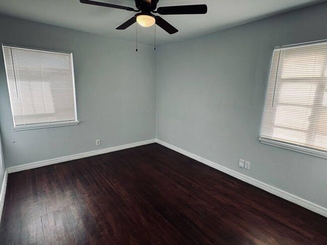 large bedroom with ceiling fan - 2115 S Polk St