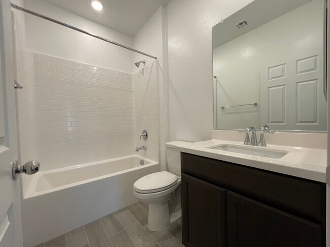 Building Photo - GATED 3 BED 3 BATH 2 CAR GARAGE TOWNHOUSE w/ LOFT + ROOM DOWNSTAIRS & COMMUNITY POOL IN HENDERSON