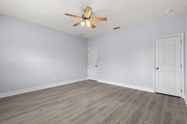 Building Photo - Spacious 6-Bedroom Home Near Lake Nona | 3-Car Garage + Tesla Charger